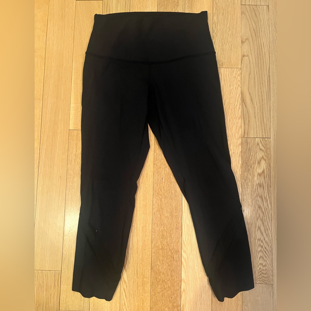 Lululemon cropped black leggings with scalloped hem and mesh detail